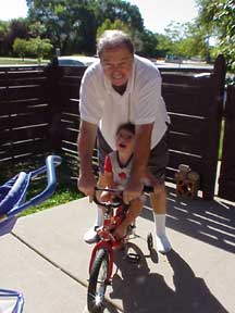 Jake on his bike 053005.  Amazing how fast they grow!