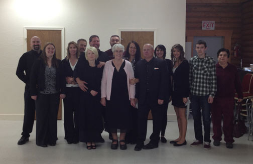 Eva Jeanne is center in Pink Sweater, far left:  Kenny Jr and wife Gillian,  Eva Jeanne's Children with David directly behind Eva Jeanne, Eva's daughter and husband, Alexis, Alyssia, Dalen and Marianne.